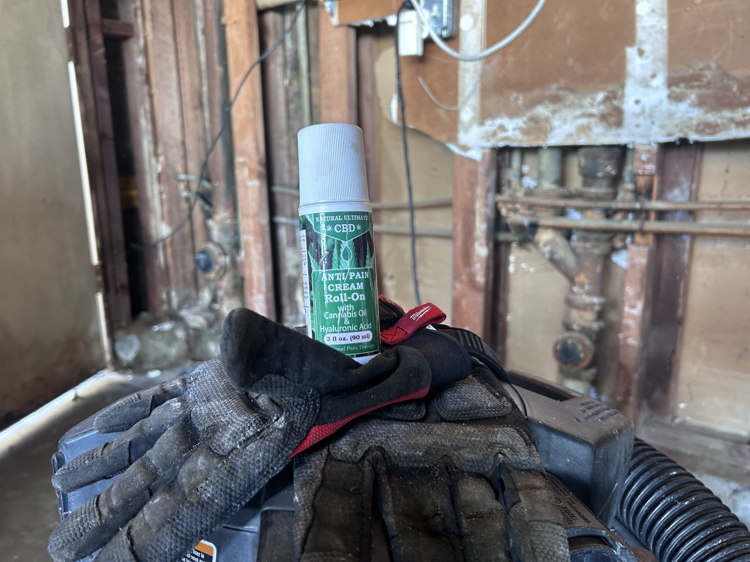 Natural Ultimate CBD roll-on used by a handyman during a long workday in Carson, California job site