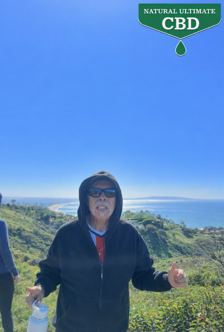 66 year old man hiking Palos Verdes coastline Los Angeles California active outdoor lifestyle CBD topical routine