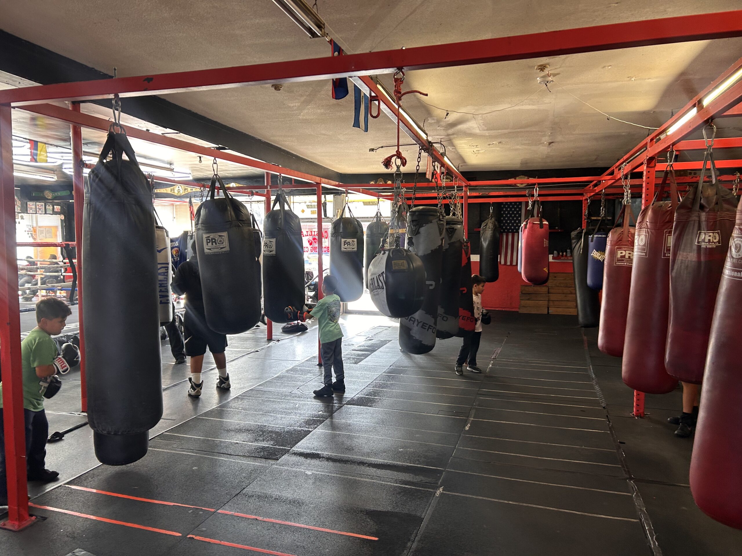 boxing heavy bag training area at Casillas Boxing Gym in Linwood California with youth and adult athletes practicing