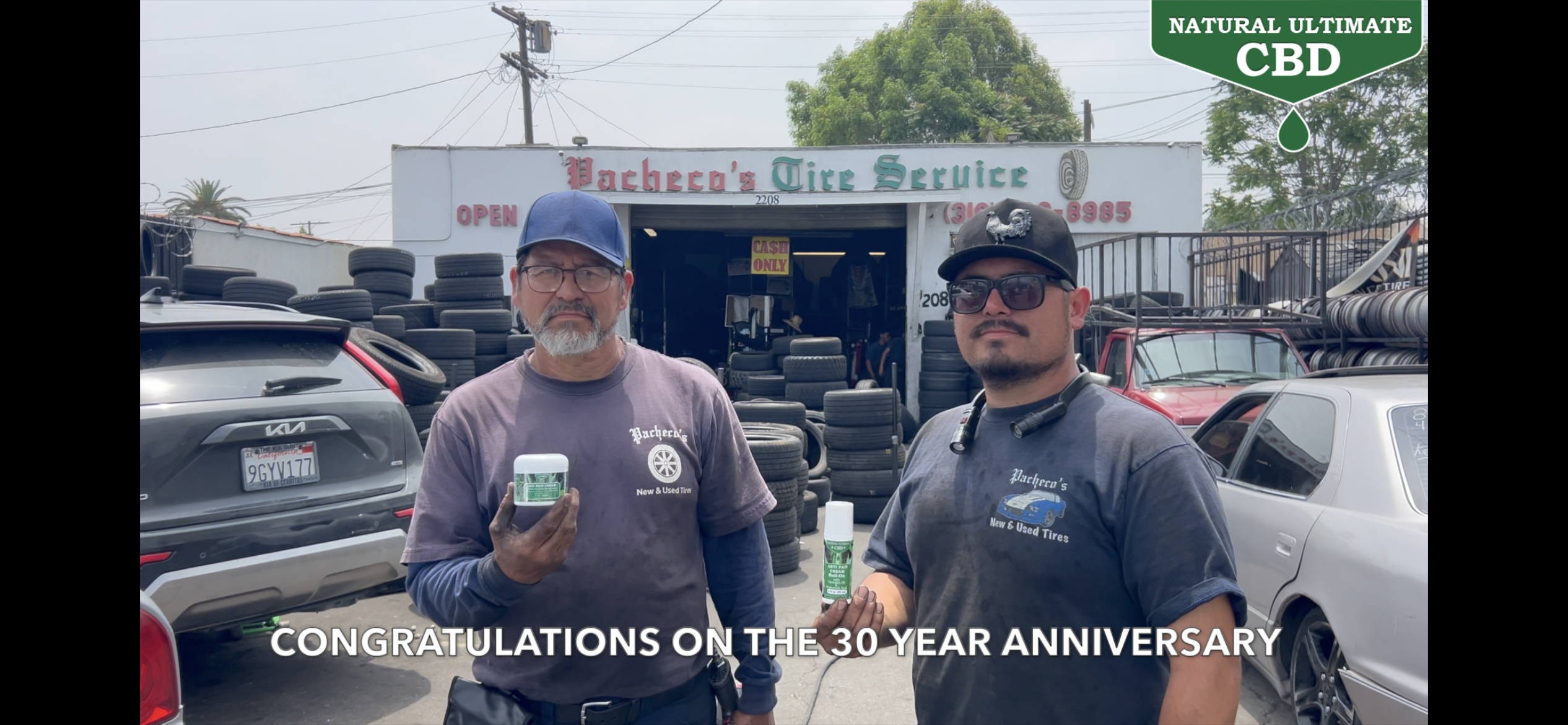 Father and son team at Pacheco's Tire Services in Compton California celebrating nearly 30 years of family-owned tire service